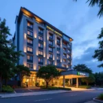 Modern hotel exterior with lush greenery near Hanoi airport