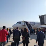 Passengers Boarding a Plane at Hirasar Airport