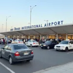 Abu Dhabi Airport Taxi Rank: Travelers waiting for taxis