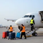 Abu Dhabi Airport Ground Staff Handling Luggage