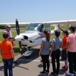 Students learning about aircraft at an airport high school