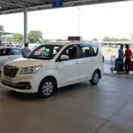 A cab arriving at the Bangalore Airport pickup zone