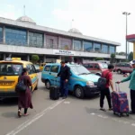 Bhubaneswar Airport Taxi Pickup Area - Travelers waiting for pre-booked taxis at Bhubaneswar Airport.