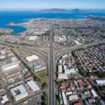 Aerial view of 20 Airport Blvd, South San Francisco, showcasing its proximity to major transportation routes and the bay.